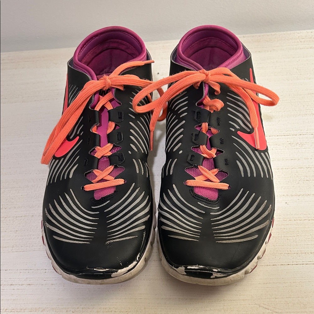 Nike Women’s Black Athletic Shoes with Pink Accents and Orange Laces